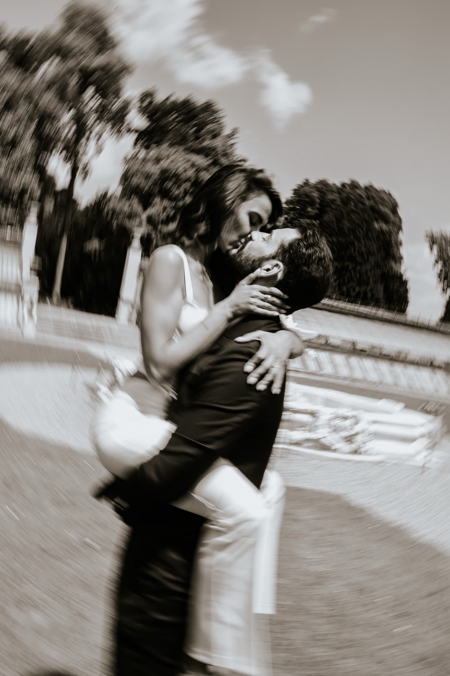 Artistic motion-blur kiss between newlyweds