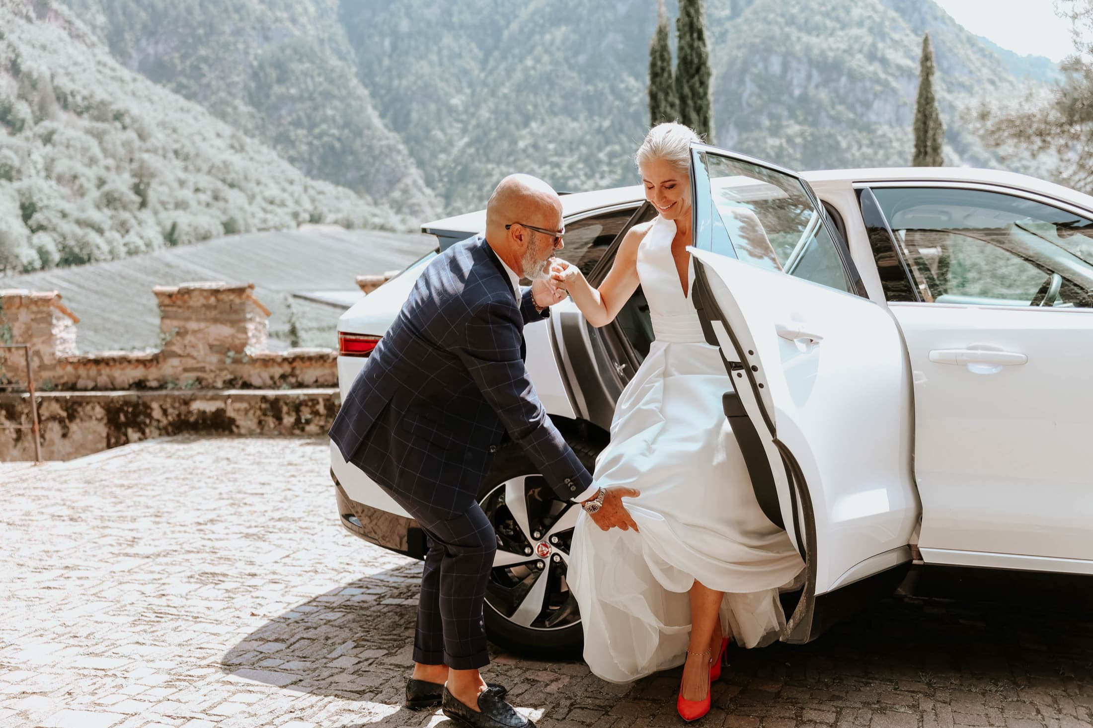 Bride arriving with a mountain backdrop