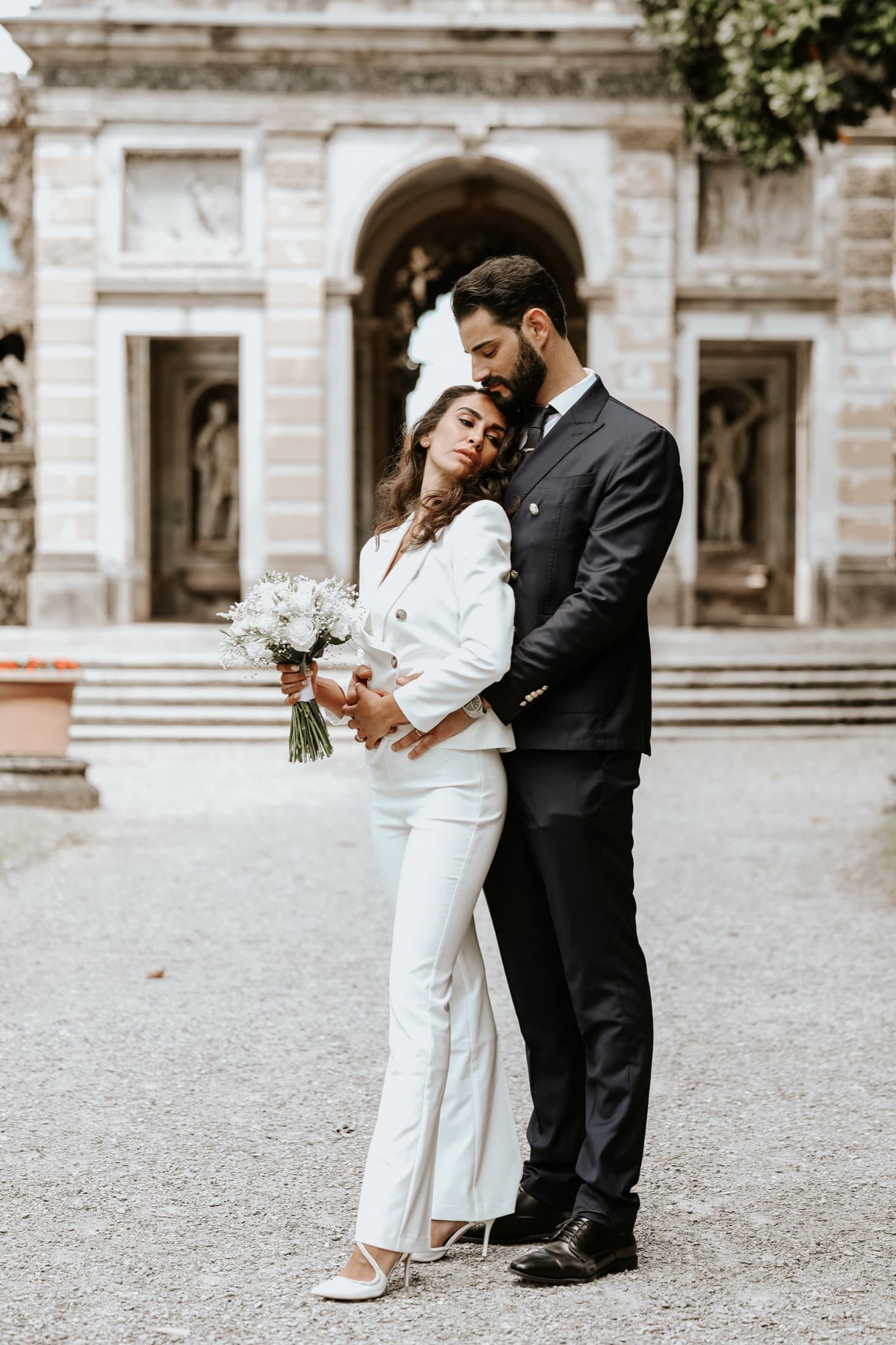 Couple embracing at a villa entrance