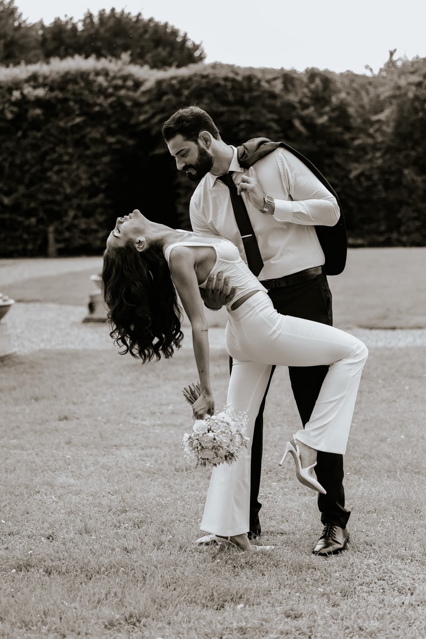Bride and groom in an editorial black and white portrait