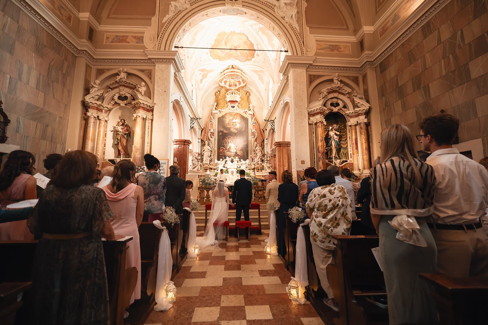 Wedding ceremony inside an Italian baroque church